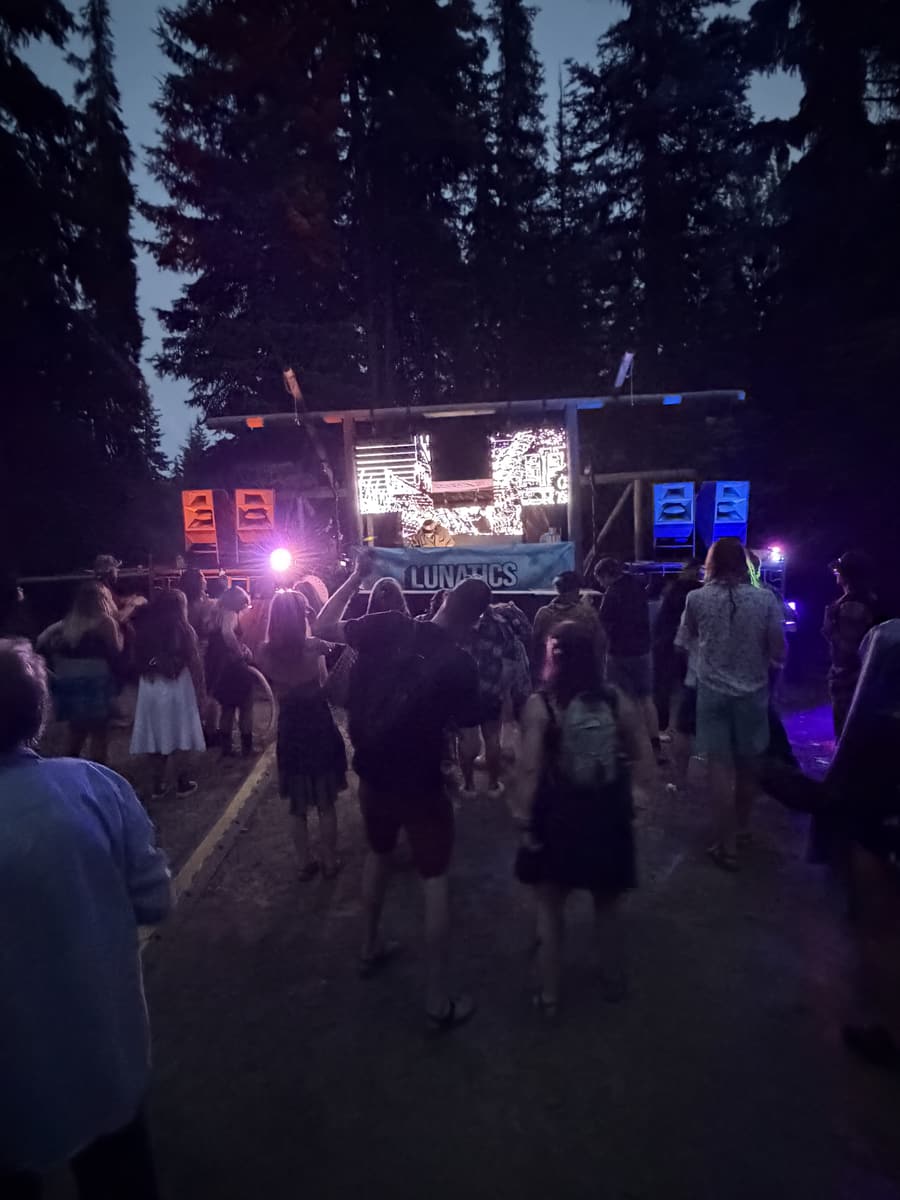 Crowd gathered in front of the stage at dusk